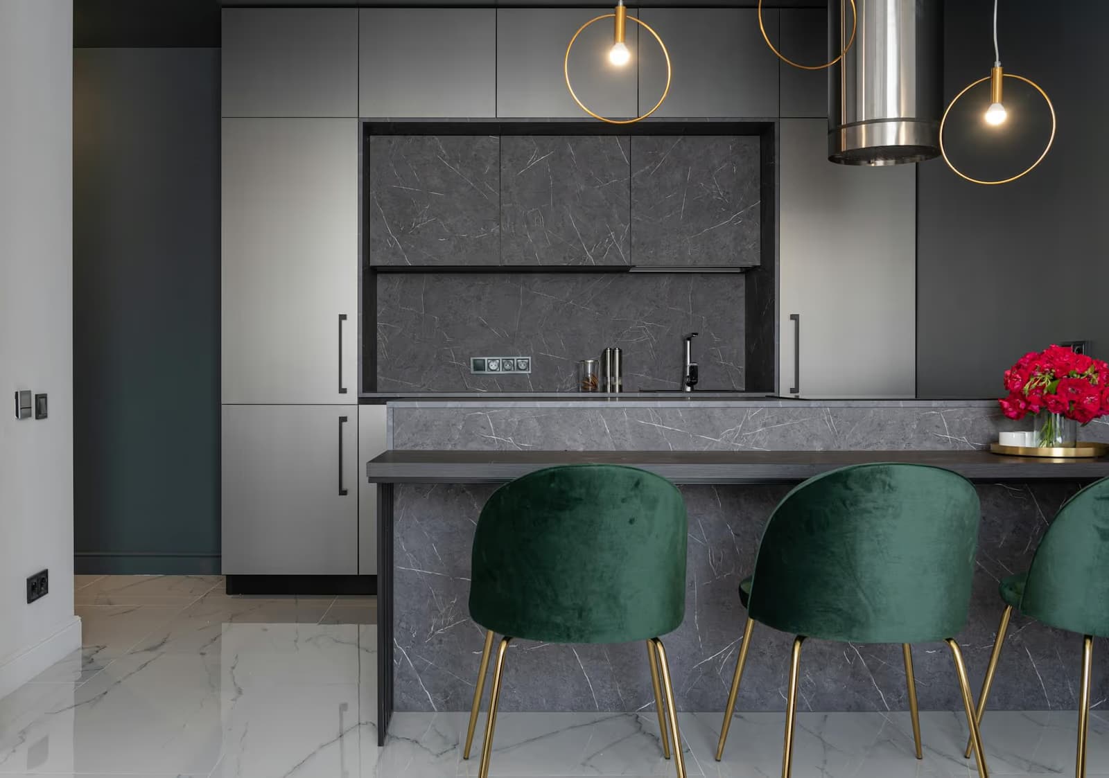 Modern kitchen with marble island and pendant lighting