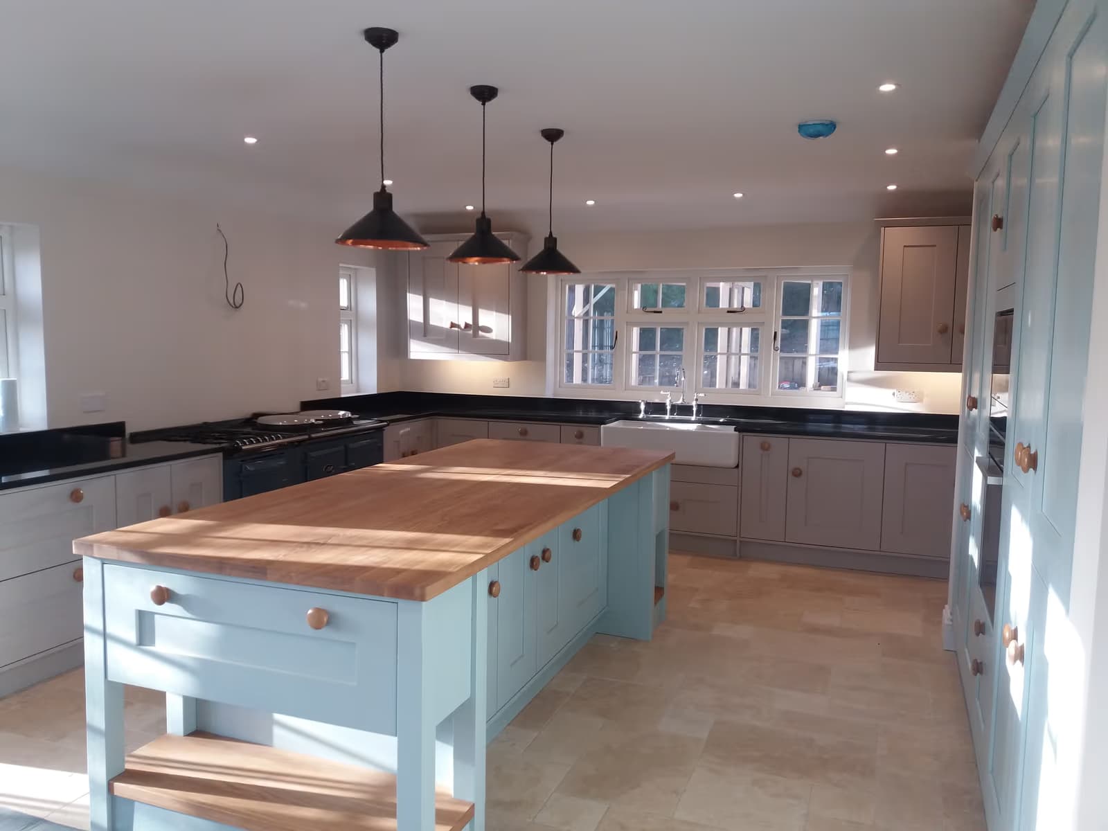 Shaker Kitchen Renovation with Copper Pendants — image 1