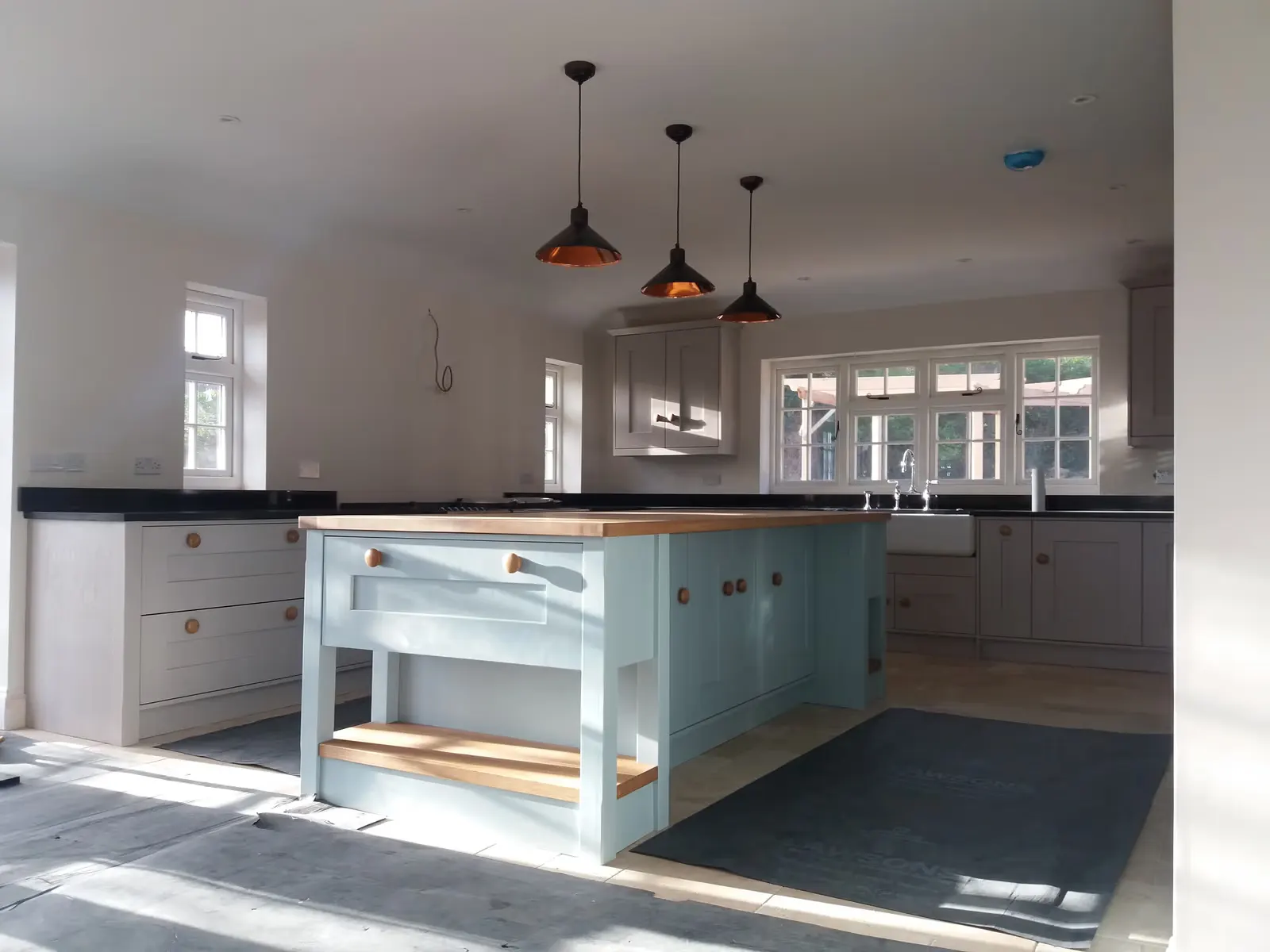 Shaker Kitchen Renovation with Copper Pendants — image 5