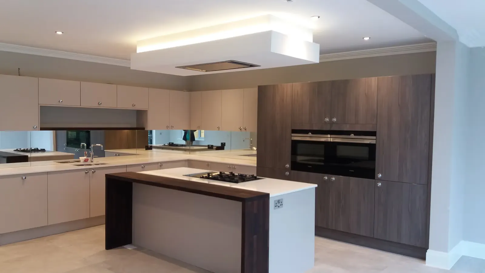 BathWright kitchen with cashmere cabinetry and dark wood finishes