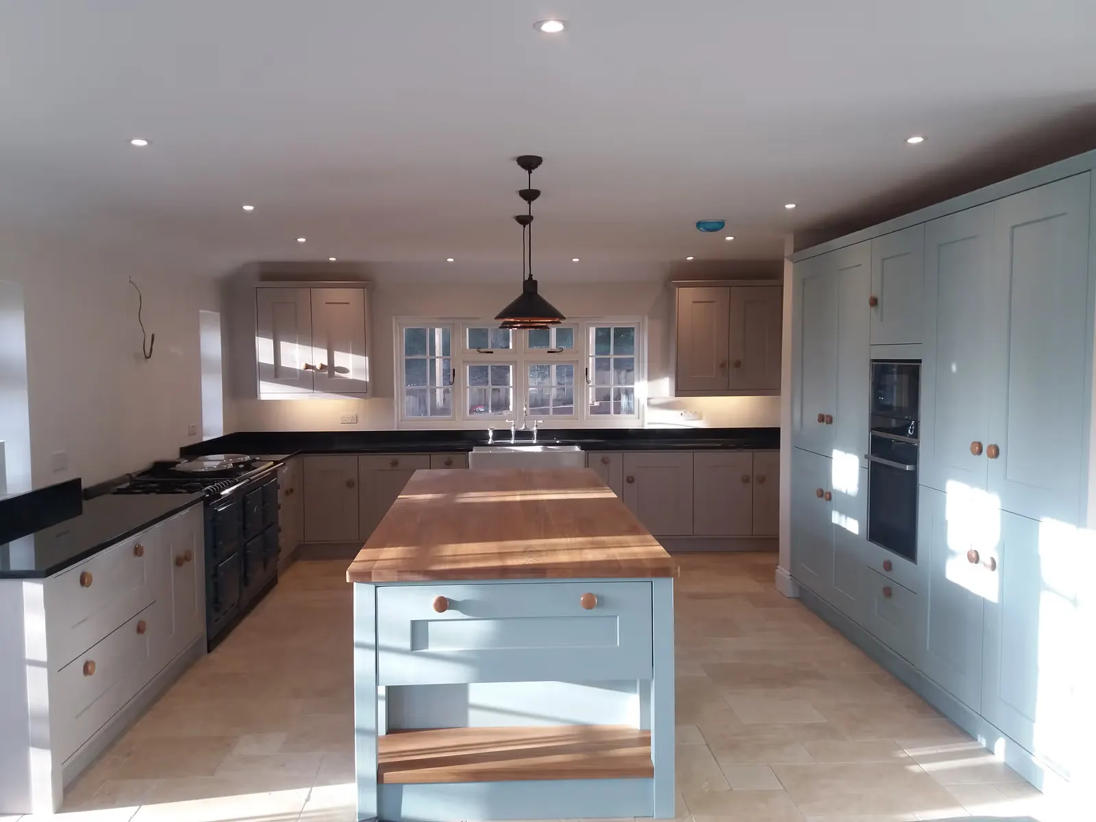 Shaker Kitchen Renovation with Copper Pendants — image 3