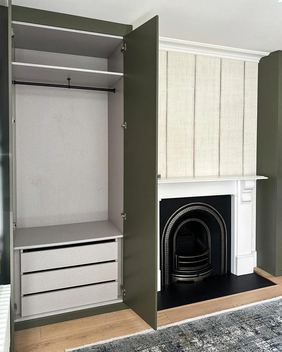Alcove wardrobe interior with hanging rail and drawers