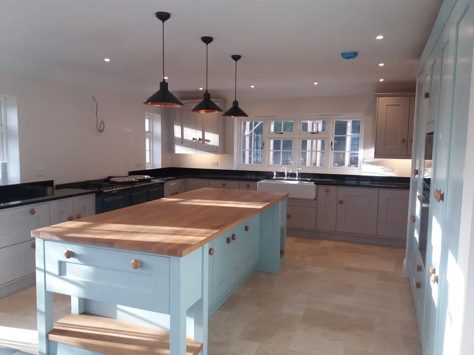 Shaker Kitchen Renovation with Copper Pendants — image 2