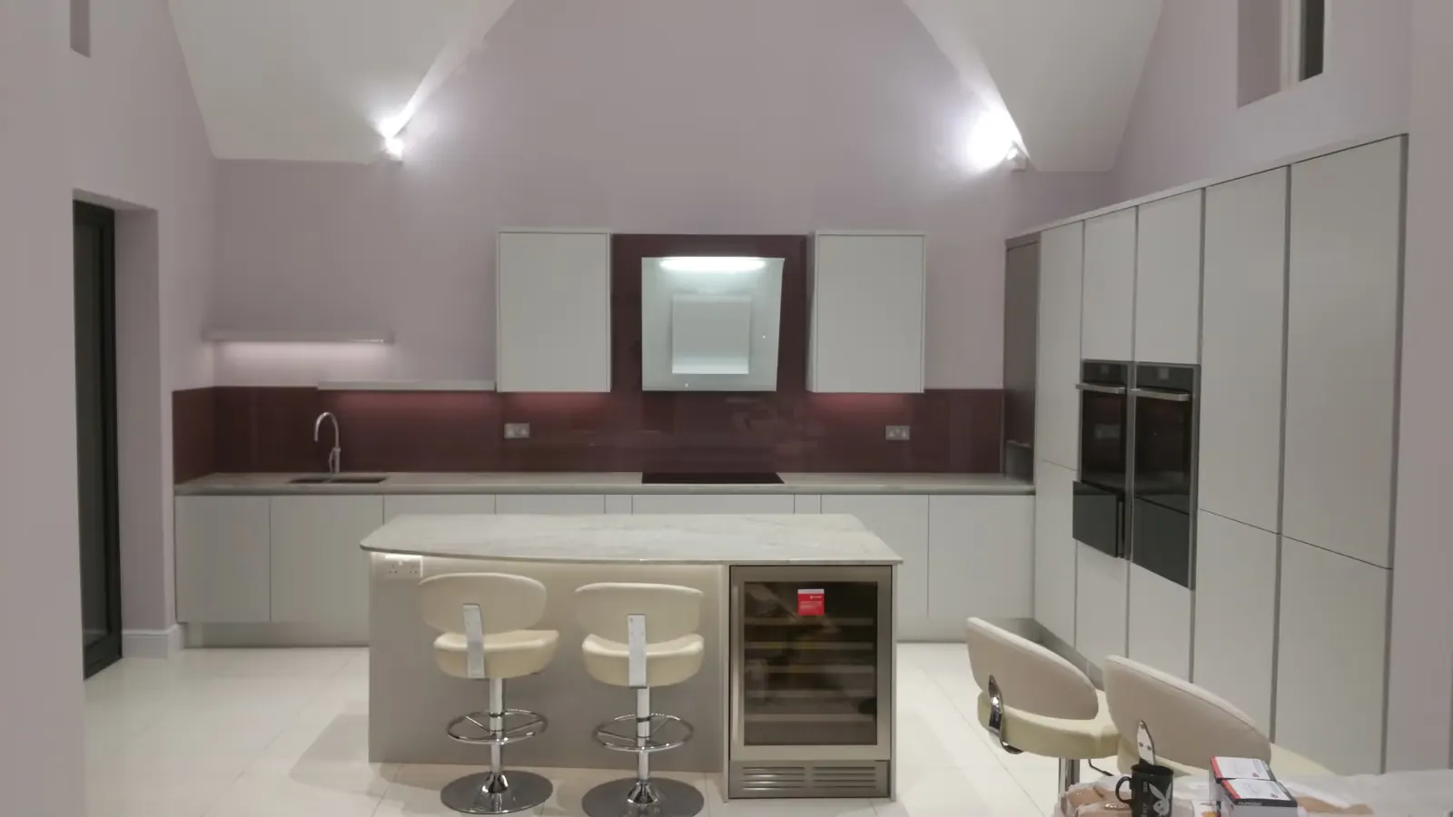 Our completed gloss kitchen with a glass splashback